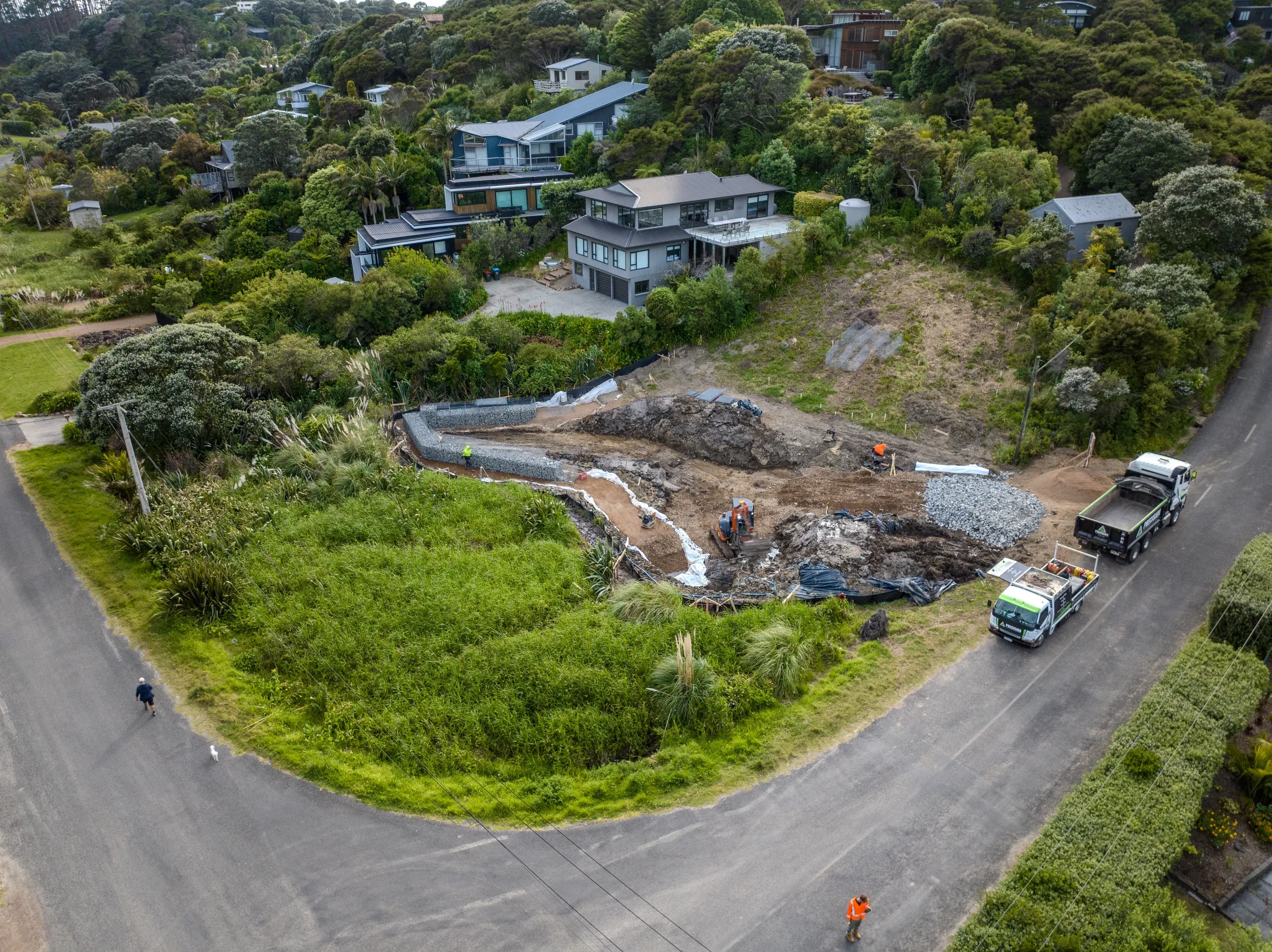 Aerial view of the works in progress, with the Precision truck and excavator on the cut platform.