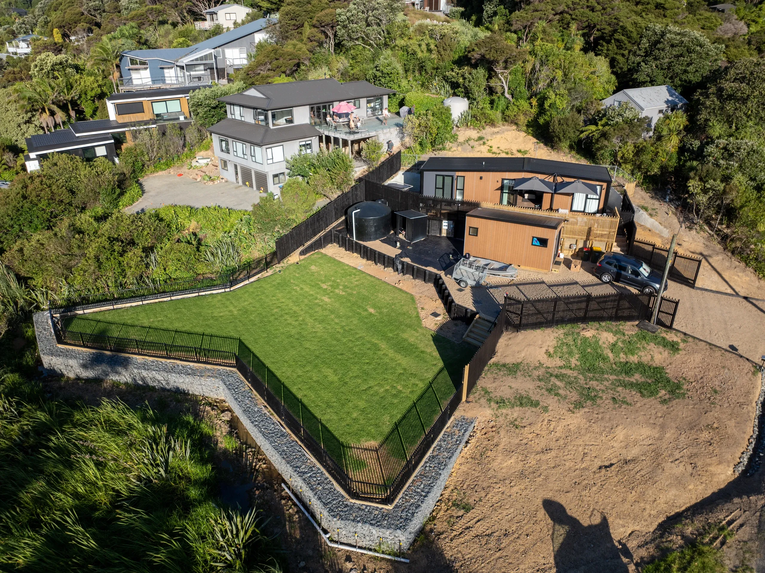 Wide aerial of the completed job, showing how much usable flat ground the terracing recovered.