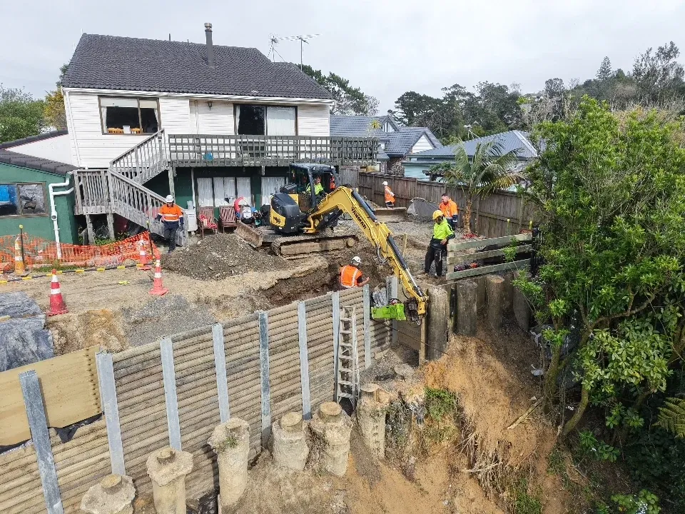 Completed retaining wall retaining a cut bank on a residential site