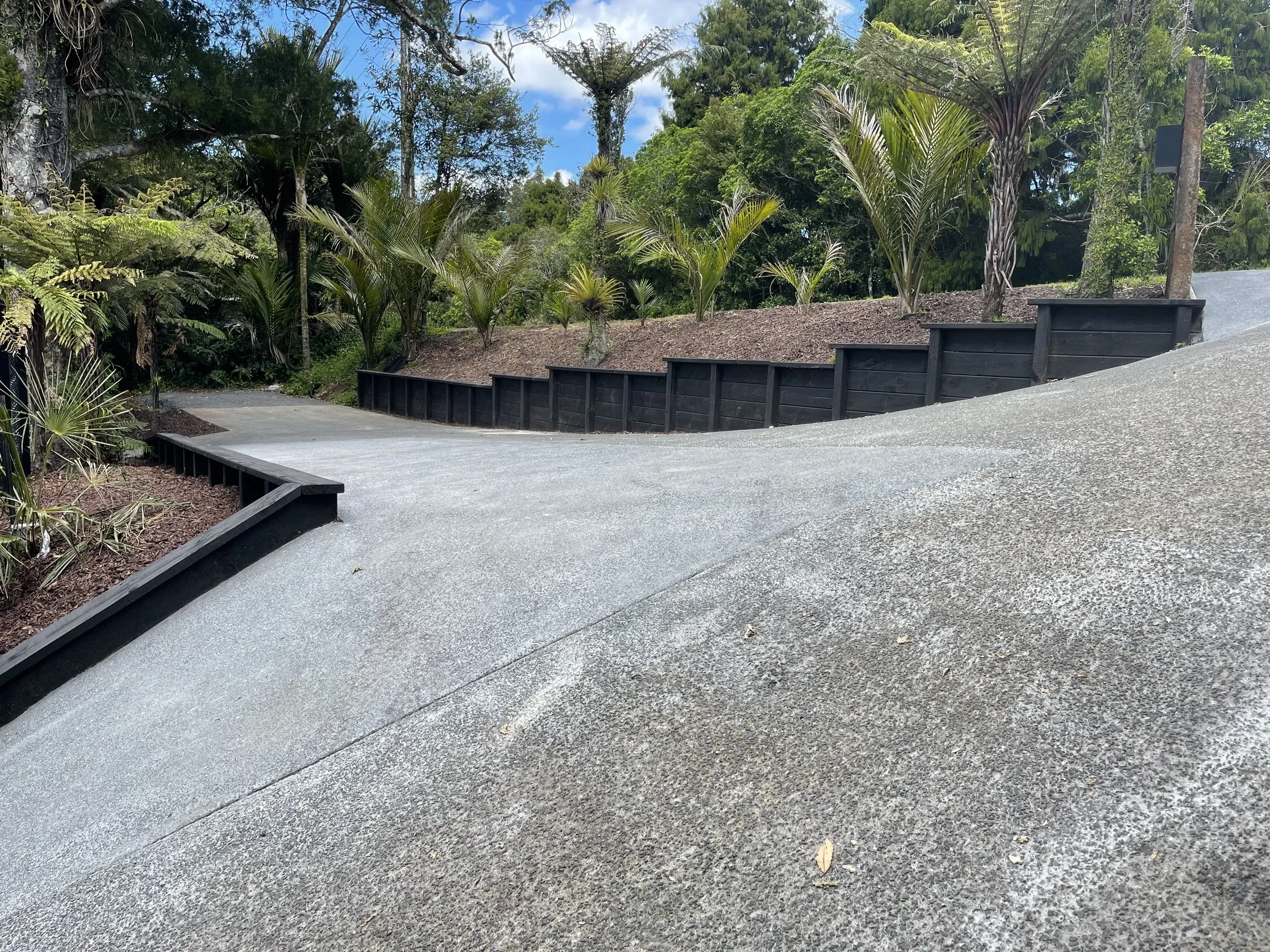 A finished retaining wall beside a modern home